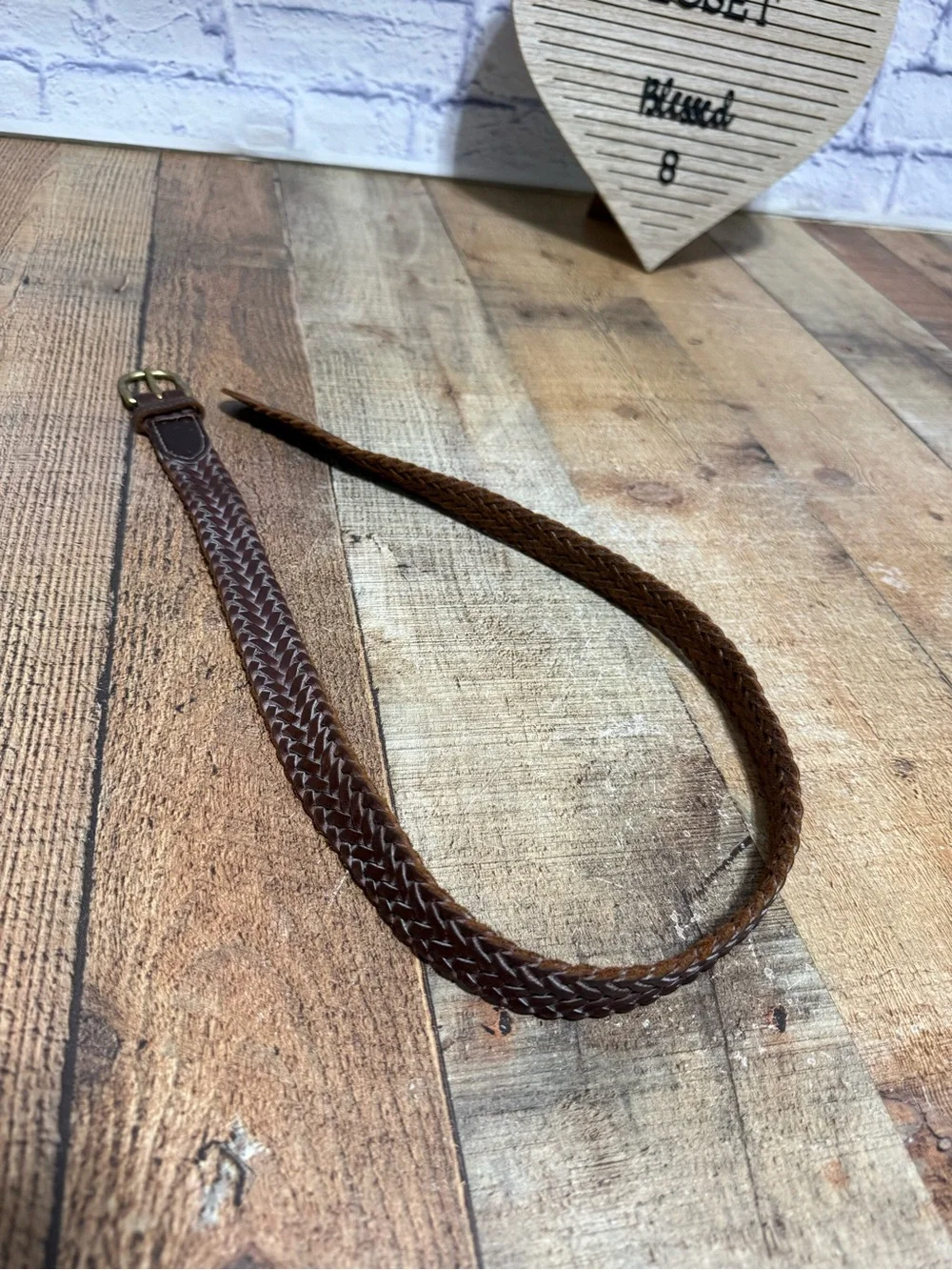 Brown leather braided belt size 31 with brass buckle